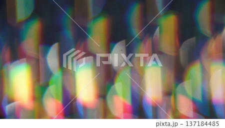 Blur circles. Lens flare. Defocused green orange neon colorful round rainbow texture glimmer optical on art abstract bokeh background. Blur circles. Lens flare. Defocused green orange neon colorful round rainbow texture glimmer optical on art abstract bokeh background. 137184485