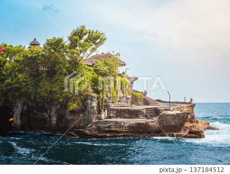 Coastal Shrine Scene. Peaceful Coastal Escarpment Featuring Weathered Steps And Lush Vegetation Coastal Shrine Scene. Peaceful Coastal Escarpment Featuring Weathered Steps And Lush Vegetation 137184512