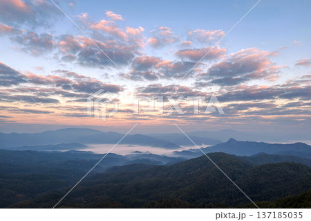 Spectacular sunrise over a mountain range with a sea of mist and colorful clouds. Spectacular sunrise over a mountain range with a sea of mist and colorful clouds. 137185035