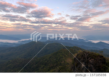 Spectacular sunrise over a mountain range with a sea of mist and colorful clouds. Spectacular sunrise over a mountain range with a sea of mist and colorful clouds. 137185036