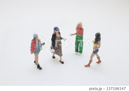 Miniature Figures Stand Beside Small Street Coffee Cart 137186147