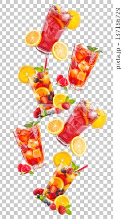 Savor a refreshing iced raspberry beverage with fruit and mint under the warm summer sun 137186729