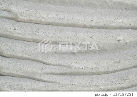 Gray textured surface with rugged, uneven, wavy patterns and gritty details Gray textured surface with rugged, uneven, wavy patterns and gritty details 137187251