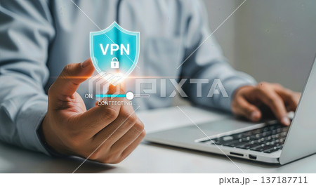 Businessman using laptop computer with virtual shield hologram and vpn padlock icon for secure internet connection and data privacy concept 137187711