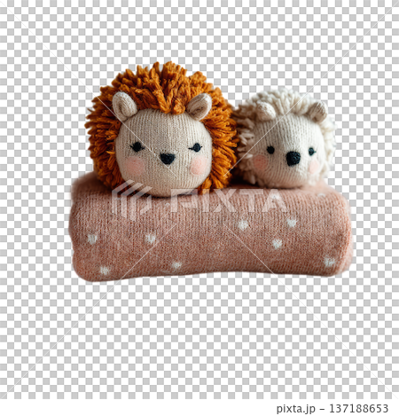 Two cute knitted hedgehog toys on a pink blanket cozy watercolor atmosphere 137188653