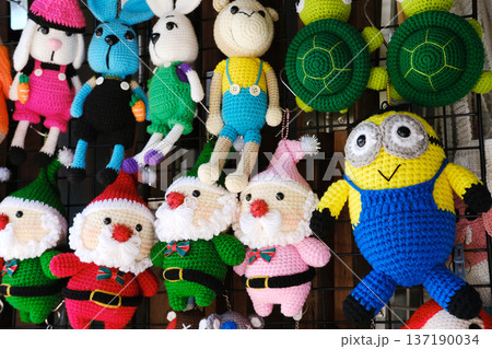 Handmade knitted toys featuring festive characters including Santa Claus, bunnies, and turtles, perfect for Christmas and New Year celebrations, showcasing vibrant colors and intricate designs Handmade knitted toys featuring festive characters including Santa Claus, bunnies, and turtles, perfect for Christmas and New Year celebrations, showcasing vibrant colors and intricate designs 137190034