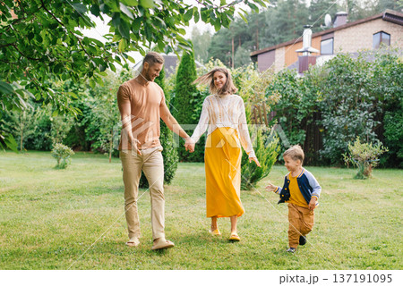 Happy Family Expecting Baby Walking Together 137191095