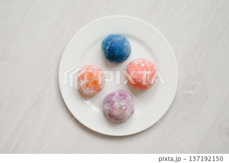 Top View of Four Colorful Mochi Rice Cakes on Round White Plate Top View of Four Colorful Mochi Rice Cakes on Round White Plate 137192150