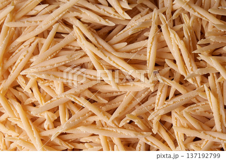 Dry Italian Pasta trofie Texture and Background for Culinary Design. 137192799