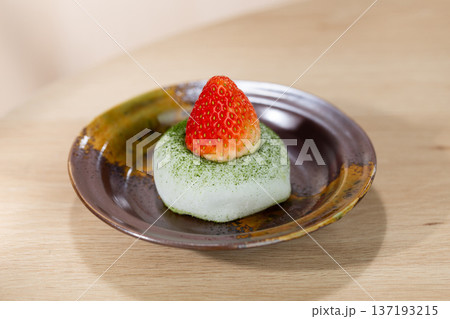 Matcha Green Tea Mochi with Fresh Strawberry Topping on Ceramic Plate Matcha Green Tea Mochi with Fresh Strawberry Topping on Ceramic Plate 137193215