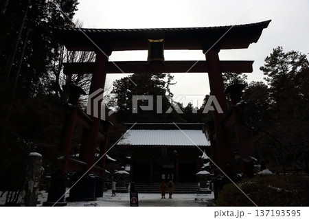 Fuji Otorii gate, mon, torii, at the Kitaguchi Hongu Fuji Sengen Jinja, shrine, on a snowy winter day in Fujiyoshida in Japan. The original gateway to the path to climb Mt. Fuji 137193595