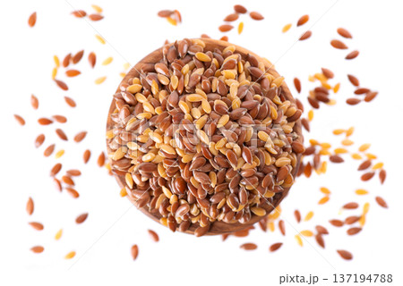 Flax seed mix isolated on white background. Golden and brown linseed or flaxseed in wooden bowl. Clipping path. Top view. 137194788
