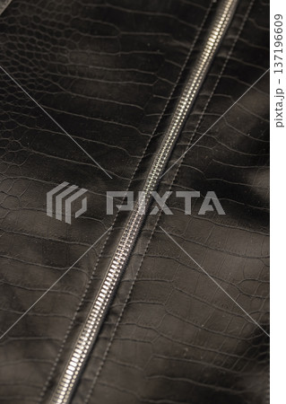 black artificial fabric in the style of crocodile skin with specks and spots, a piece of clothing made in the style of leather black artificial fabric in the style of crocodile skin with specks and spots, a piece of clothing made in the style of leather 137196609