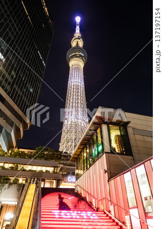 Night view of Tokyo Skytree, with beautiful reflections of the majestic tower in the Sumida River, it's the primary television and radio broadcast site in the Kanto region, Japan. 137197154