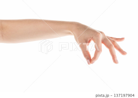 Young woman hand holding something with fingers from the top isolated on white background Young woman hand holding something with fingers from the top isolated on white background 137197904