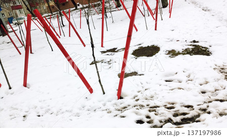 Sidewalk. Melting snow on the ground. Sidewalk. Melting snow on the ground. 137197986