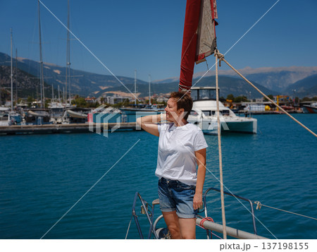 Woman Sailor Handling Sails Preparing For Navigation In Sea Woman Sailor Handling Sails Preparing For Navigation In Sea 137198155