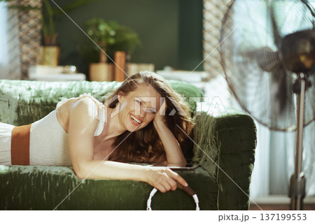 Content Woman Posing Comfortably at Home 137199553