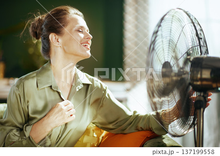 Serene Woman Enjoying Cool Breeze at Home 137199558