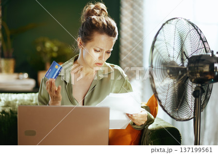 Woman Focused on Managing Home Finances Woman Focused on Managing Home Finances 137199561