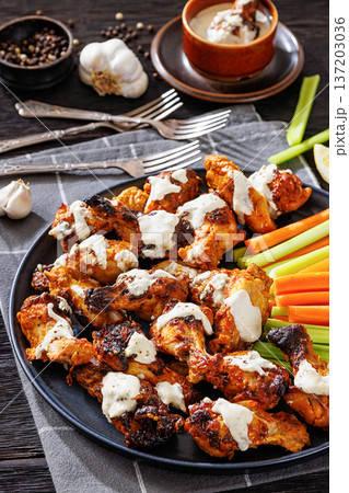 alabama white sauce chicken wings with vegetables alabama white sauce chicken wings with vegetables 137203036