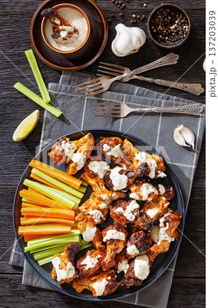 alabama white sauce chicken wings with vegetables alabama white sauce chicken wings with vegetables 137203039