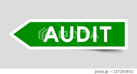 Green color arrow shape sticker label with word audit on gray background 137203652