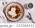 Boiled chicken fillet and mixed vegetables on a plate on the table top view 137204333