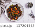 Vegetarian soba with mexican mixed vegetables on a plate on the table top view 137204342