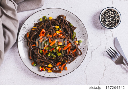 Vegetarian soba with mexican mixed vegetables on a plate on the table top view Vegetarian soba with mexican mixed vegetables on a plate on the table top view 137204342
