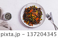 Buckwheat soba noodles with vegetables on a plate on the table top view web banner 137204345