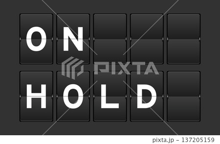 Black color analog flip board with word on hold on gray background Black color analog flip board with word on hold on gray background 137205159