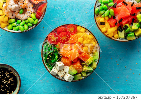 Poke bowl assortment. Rice with salmon, shrimps, and grapefruit 137207867