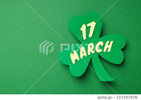 A shamrock with the date March 17 shown in bold letters A shamrock with the date March 17 shown in bold letters 137207876