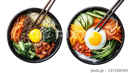 Korean bibimbap dish with fresh vegetables, fried egg, and gochujang sauce in black bowl isolated on white background 137208769