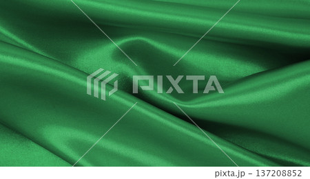 Smooth elegant green silk or satin luxury cloth texture as abstract background. Luxurious background design 137208852