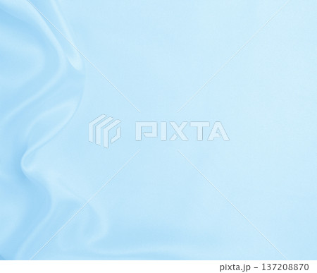 Smooth elegant blue silk or satin luxury cloth texture as abstract background. Luxurious background design Smooth elegant blue silk or satin luxury cloth texture as abstract background. Luxurious background design 137208870