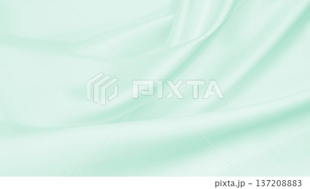 Smooth elegant green silk or satin luxury cloth texture as abstract background. Luxurious background design Smooth elegant green silk or satin luxury cloth texture as abstract background. Luxurious background design 137208883