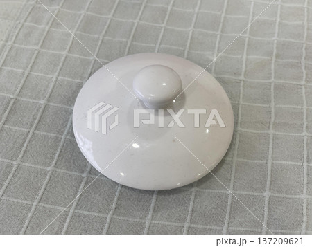 a lid of a bowl on the table 137209621