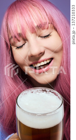 Pink haired woman enjoying beer close up portrait. Pink haired woman enjoying beer close up portrait. 137210333