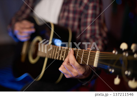 Close-Up of Guitarist Playing Acoustic Guitar Close-Up of Guitarist Playing Acoustic Guitar 137211546