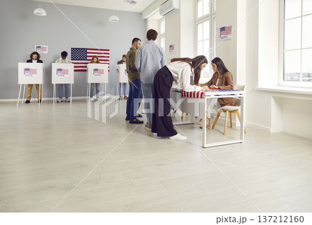 Side view portrait of young girl registering at polling station with American flags on election day Side view portrait of young girl registering at polling station with American flags on election day 137212160
