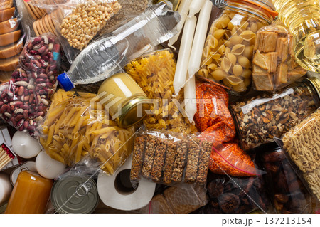 Essential home food stock for military operations and crises and for the period of quarantine and isolation, canned food, pasta, flour and nonperishable items,the concept of stay at home 137213154