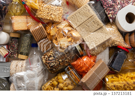 Essential home food stock for military operations and crises and for the period of quarantine and isolation, canned food, pasta, flour and nonperishable items,the concept of stay at home 137213181