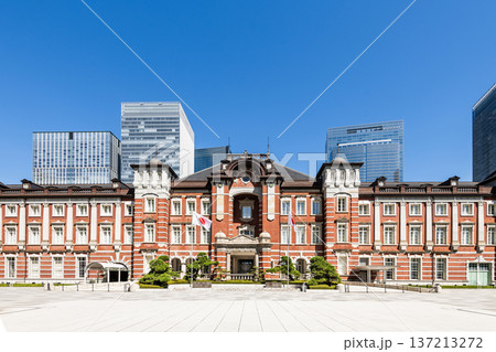 Building view of the Tokyo Station. It's a major inter-city rail terminal in Chiyoda, Tokyo, Japan. located in the Marunouchi business district. Building view of the Tokyo Station. It's a major inter-city rail terminal in Chiyoda, Tokyo, Japan. located in the Marunouchi business district. 137213272