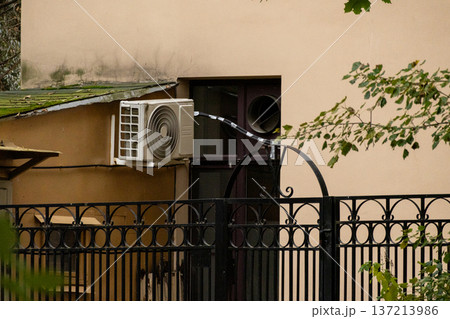 air conditioning on facade of building, air cooling in hot weather.  137213986