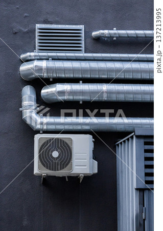 air conditioning on facade of building, air cooling in hot weather.  137213995