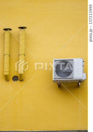 air conditioning on facade of building, air cooling in hot weather.  137213999