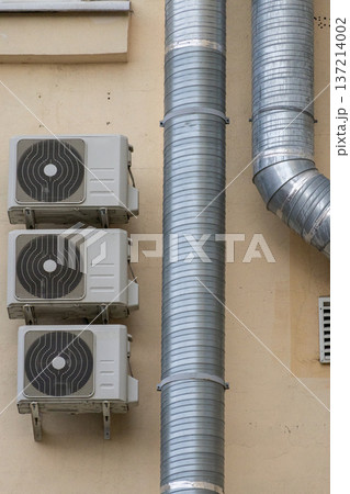 air conditioning on facade of building, air cooling in hot weather.  137214002