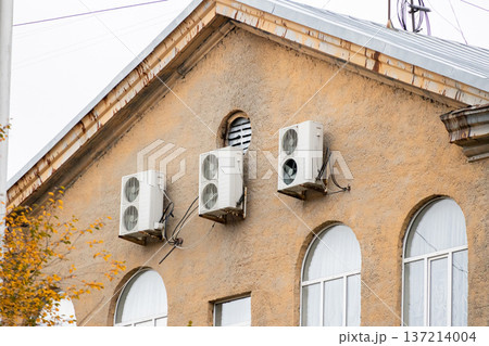 air conditioning on facade of building, air cooling in hot weather.  137214004
